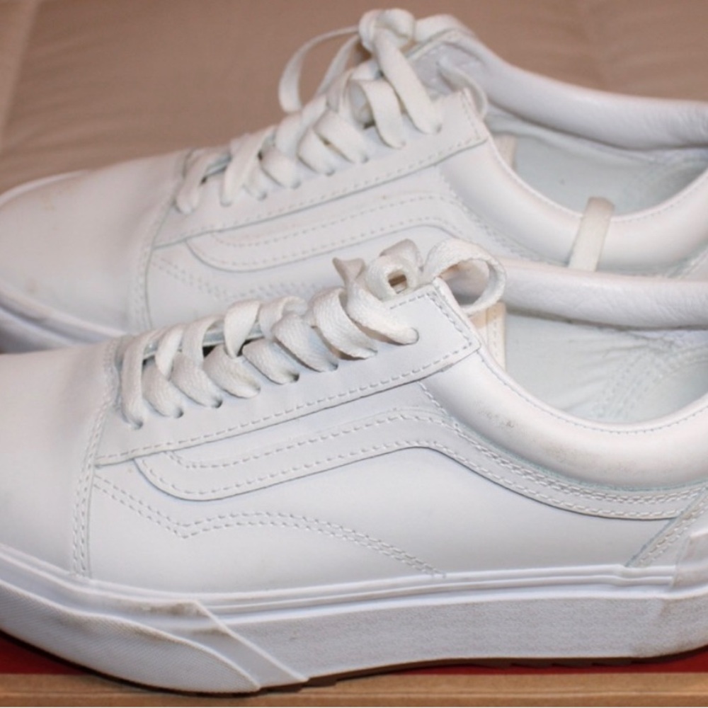 Women’s Vans platform white leather sneakers.